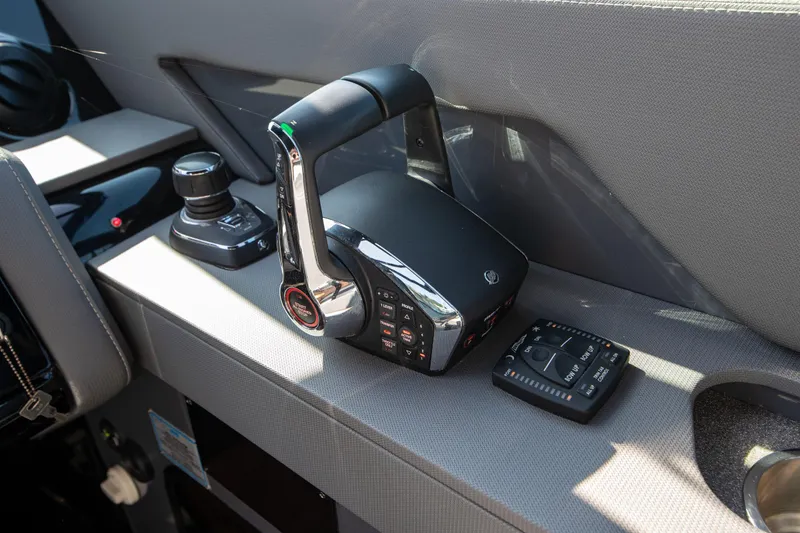 Slide: The Image of 2024 Cruisers Yachts 38 GLS OB helm controls and joystick on dashboard. - 7