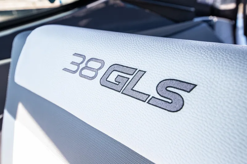 Slide: The Image of 2024 Cruisers Yachts 38 GLS OB logo on white upholstery. - 8