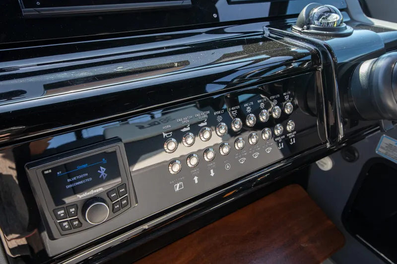 Slide: The Image of Control panel of 2024 Cruisers Yachts 38 GLS OB with Bluetooth and navigation features. - 9