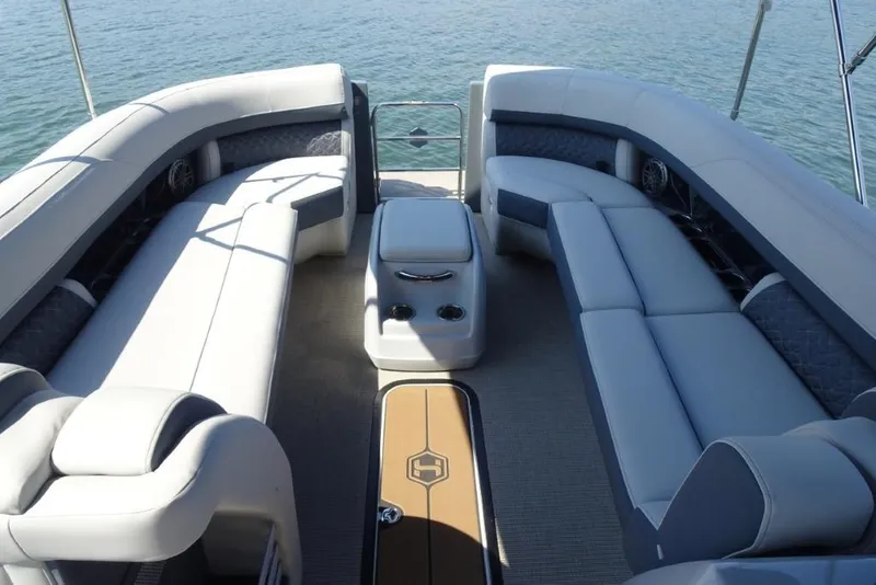 Slide: The Image of Luxurious seating on 2026 Harris Grand Mariner 250 pontoon boat, overlooking serene water. - 19