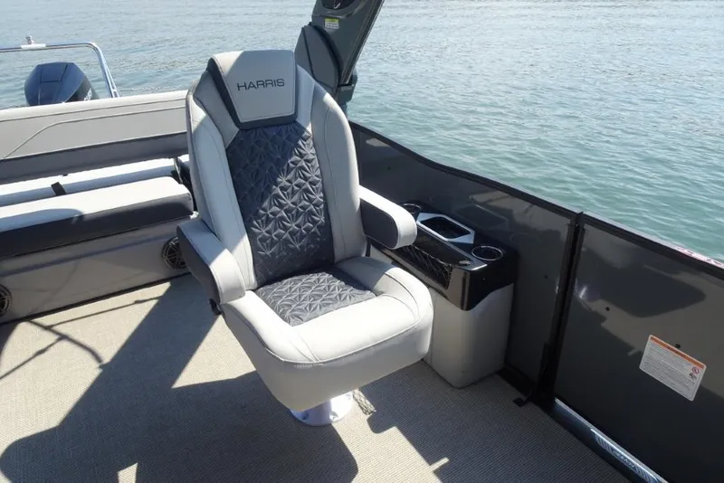Slide: The Image of Luxury seating on 2026 Harris Grand Mariner 250 pontoon boat, overlooking serene water. - 24