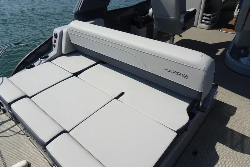 Slide: The Image of 2026 Harris Grand Mariner 250 boat interior with luxurious seating on the water. - 8