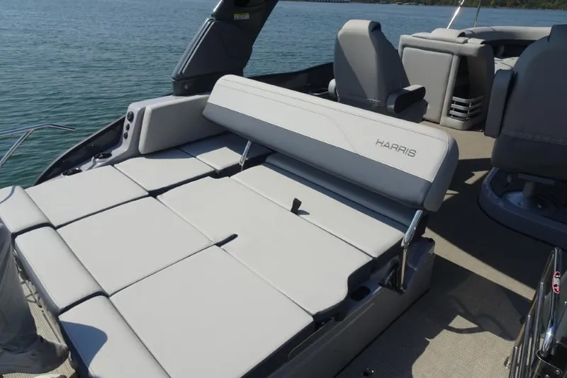 Slide: The Image of 2026 Harris Grand Mariner 250 boat with luxurious seating on a sunny day. - 9