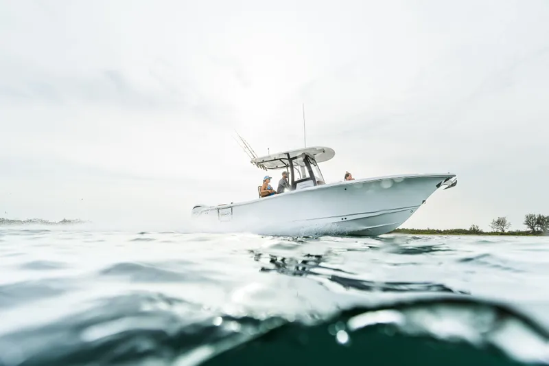 Slide: The Image of 2026 Sea Hunt Ultra 265 SE boat cruising on open water. - 10