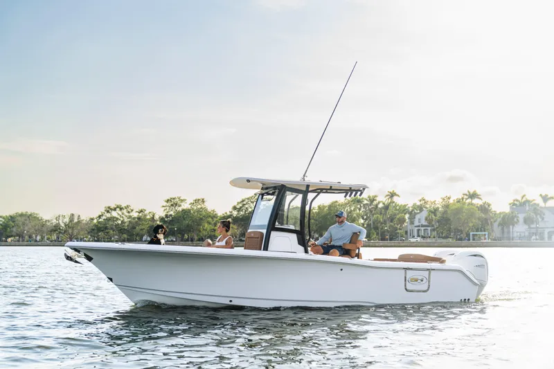 Slide: The Image of 2026 Sea Hunt Ultra 265 SE boat cruising on a sunny day with passengers. - 14