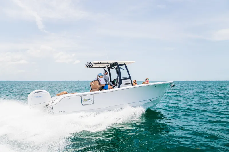 Slide: The Image of 2026 Sea Hunt Ultra 265 SE boat cruising on open water, clear sky background. - 3