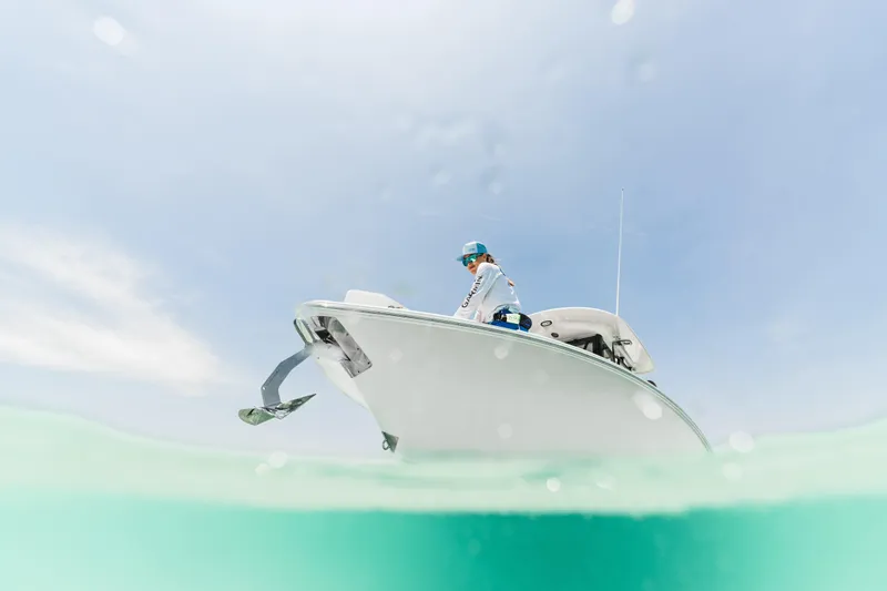 Slide: The Image of 2026 Sea Hunt Ultra 265 SE boat on clear water, person onboard, sunny day. - 4