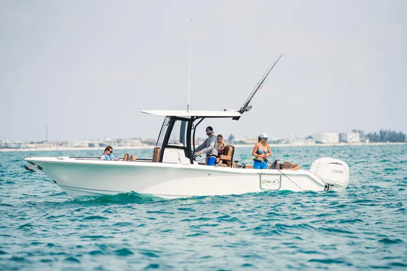 Slide: The Image of 2026 Sea Hunt Ultra 265 SE boat with people fishing on open water. - 6