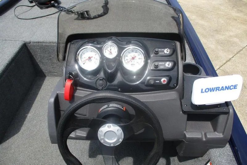 Slide: The Image of 2022 Tracker Pro 170 boat dashboard with gauges and Lowrance device. - 7