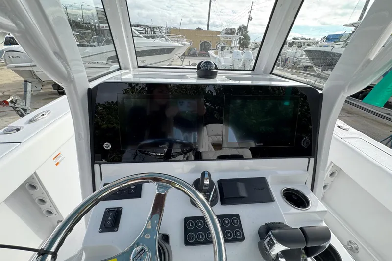Slide: The Image of 2026 Sportsman Heritage 261 Center Console dashboard with modern navigation and control systems. - 10