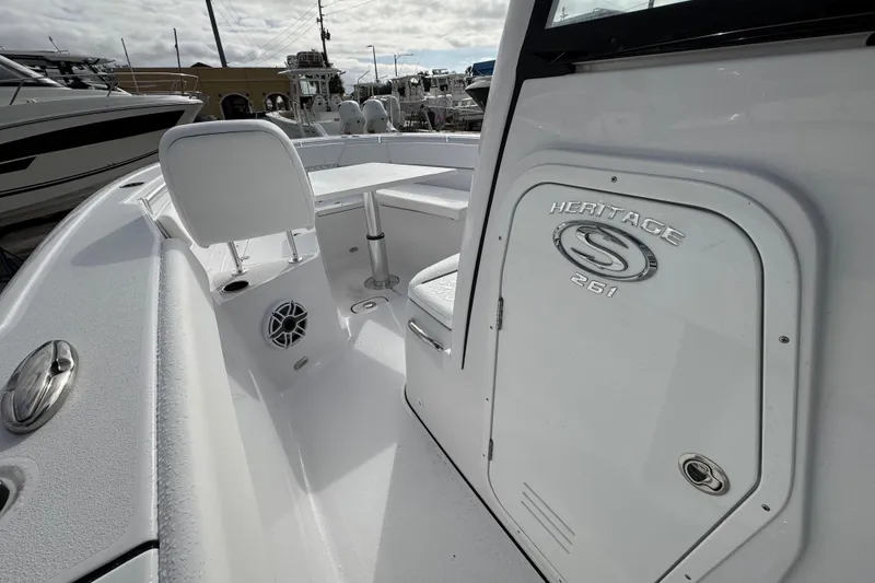 Slide: The Image of 2026 Sportsman Heritage 261 Center Console boat interior with seating and storage. - 11