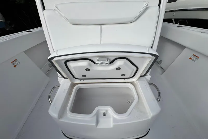 Slide: The Image of 2026 Sportsman Heritage 261 Center Console boat with open storage compartment. - 15