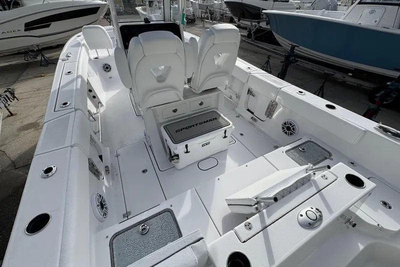 Slide: The Image of 2026 Sportsman Heritage 261 Center Console boat interior with seating and storage features. - 4