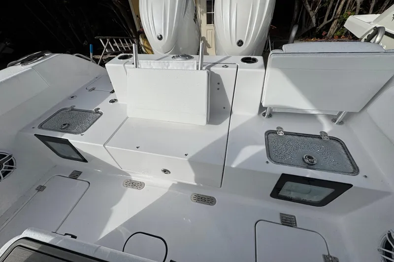 Slide: The Image of 2026 Sportsman Heritage 261 Center Console boat interior with seating and storage compartments. - 5