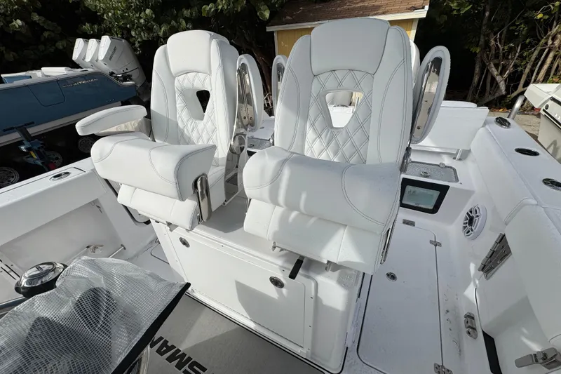 Slide: The Image of 2026 Sportsman Heritage 261 Center Console with luxurious white seating and modern design. - 8
