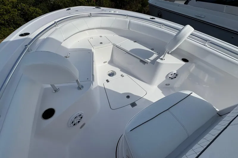 Slide: The Image of 2026 Sportsman Heritage 231 Center Console boat interior with seating and storage compartments. - 13