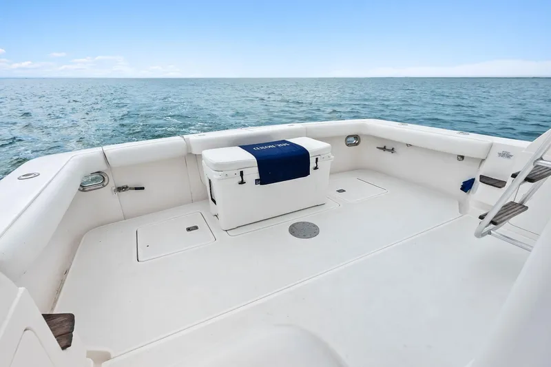 Slide: The Image of 2006 Bertram 39 Convertible boat deck with ocean view and cooler. - 21