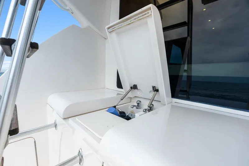 Slide: The Image of 2006 Bertram 39 Convertible yacht deck with open storage compartment. - 25