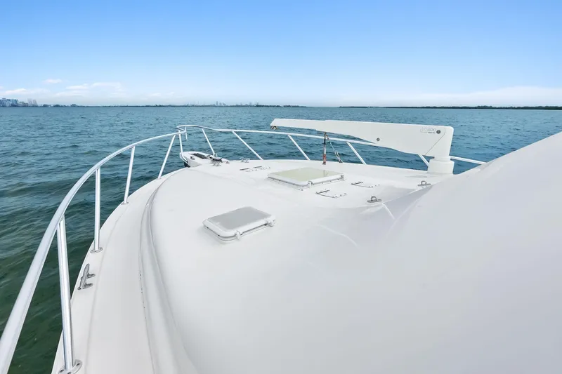 Slide: The Image of 2006 Bertram 39 Convertible yacht on open water, showcasing sleek deck design. - 30