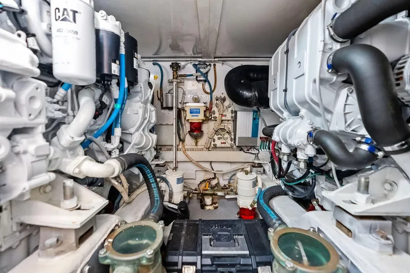 Slide: The Image of Engine room of a 2006 Bertram 39 Convertible yacht, showcasing mechanical components. - 53