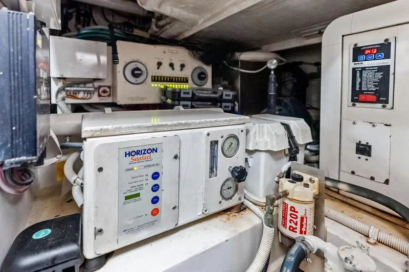 Slide: The Image of Engine room of 2006 Bertram 39 Convertible with Horizon Seafari system and control panels. - 56