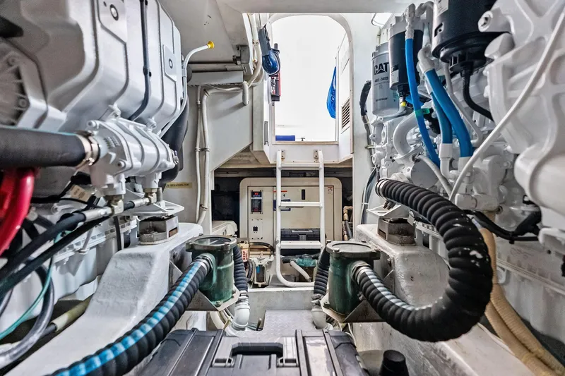 Slide: The Image of Engine room of a 2006 Bertram 39 Convertible yacht, showcasing mechanical components and systems. - 57