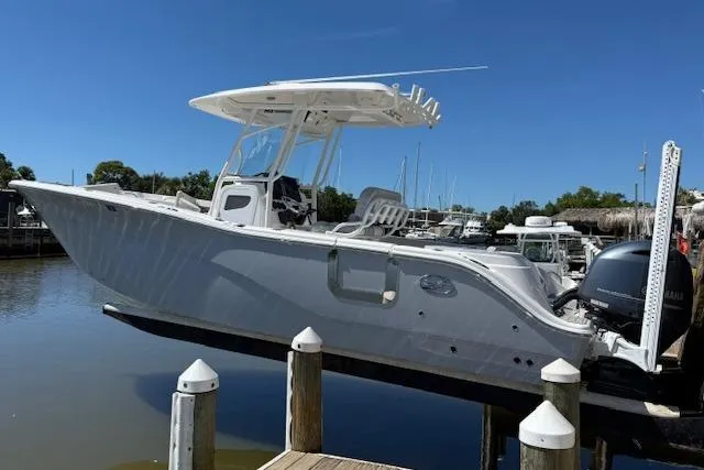 The Image of 2023 Sea Fox 268 Commander boat docked at marina under clear blue sky. - 0
