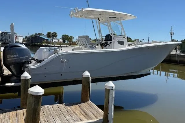 Slide: The Image of 2023 Sea Fox 268 Commander boat docked with Yamaha engine. - 1
