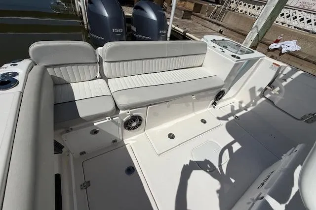 Slide: The Image of 2023 Sea Fox 268 Commander boat interior with seating and dual engines. - 11