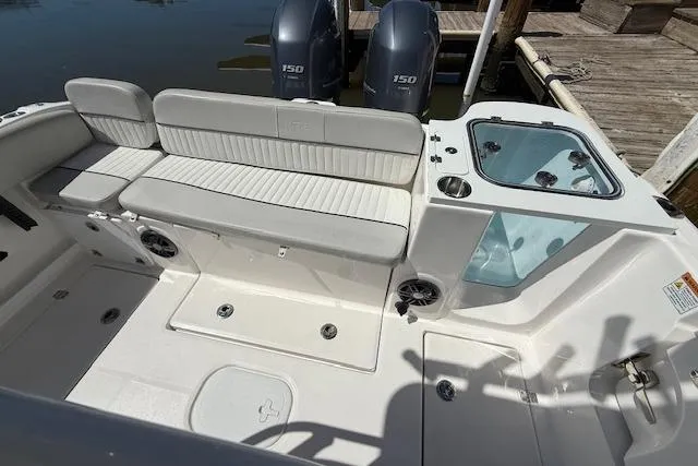 Slide: The Image of 2023 Sea Fox 268 Commander boat interior with seating and dual engines. - 12
