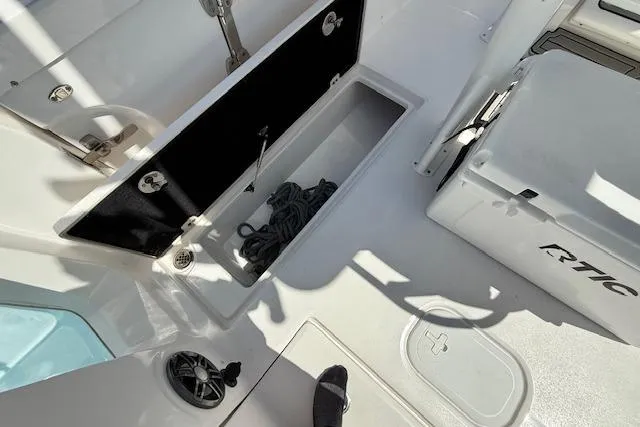 Slide: The Image of 2023 Sea Fox 268 Commander boat deck with storage compartment and cooler. - 16