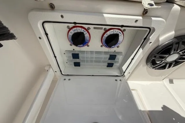Slide: The Image of Control panel on 2023 Sea Fox 268 Commander boat, featuring dials and speaker. - 18