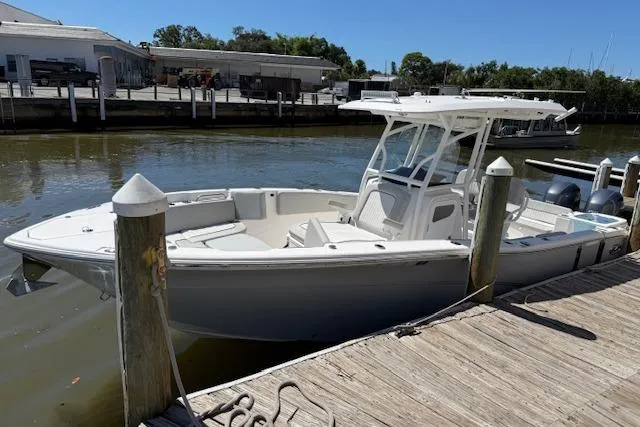 Slide: The Image of 2023 Sea Fox 268 Commander boat docked at a marina on a sunny day. - 3