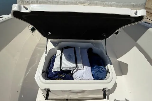 Slide: The Image of Open storage compartment on 2023 Sea Fox 268 Commander boat, filled with gear. - 35