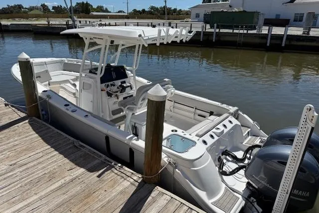 Slide: The Image of 2023 Sea Fox 268 Commander boat docked, featuring dual Yamaha engines and spacious deck. - 4