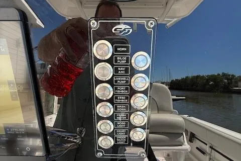 Slide: The Image of Control panel of 2023 Sea Fox 268 Commander boat with labeled buttons. - 40