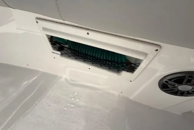 Slide: The Image of 2023 Sea Fox 268 Commander boat interior detail with storage compartment and speaker. - 45