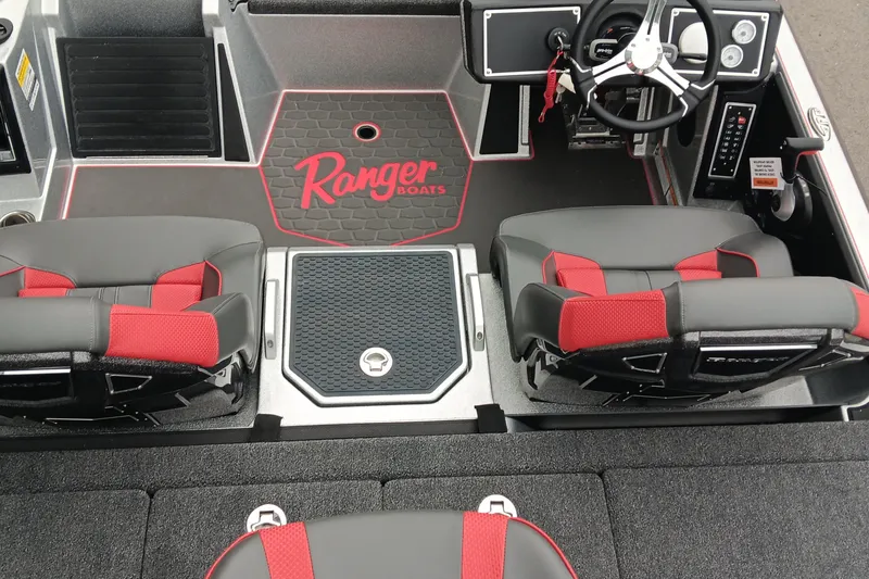 Slide: The Image of Interior of 2026 Ranger Z520 boat with red and black seating and steering console. - 11