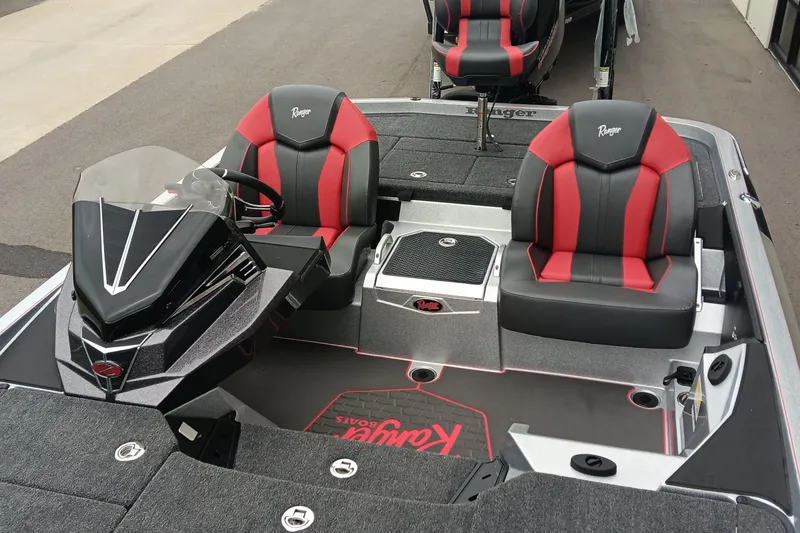 Slide: The Image of 2026 Ranger Z520 boat interior with red and black seats, sleek console design. - 12
