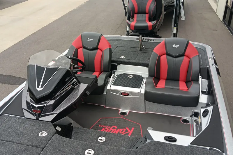 Slide: The Image of 2026 Ranger Z520 boat interior with red and black seats, sleek design. - 13