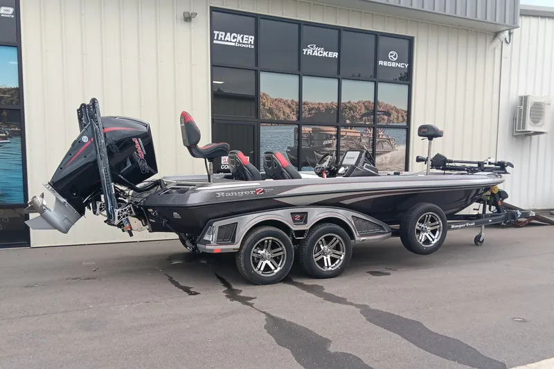 Slide: The Image of 2026 Ranger Z520 boat on trailer outside Tracker Boats dealership. - 2