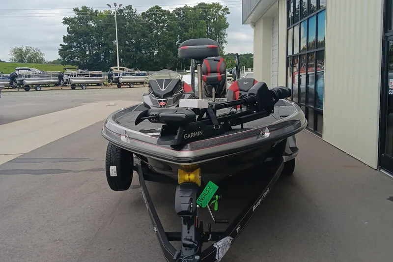 Slide: The Image of 2026 Ranger Z520 boat with Garmin equipment, parked outside a showroom. - 4