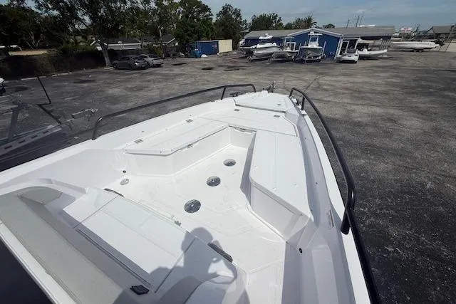 Slide: The Image of 2025 Axopar 29 Sun Top boat with spacious deck and seating area. - 5