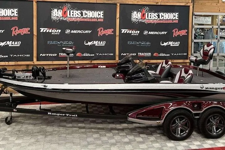 The Image of 2018 Ranger Z520L boat displayed at Anglers Choice showroom with branded backdrop. - 1