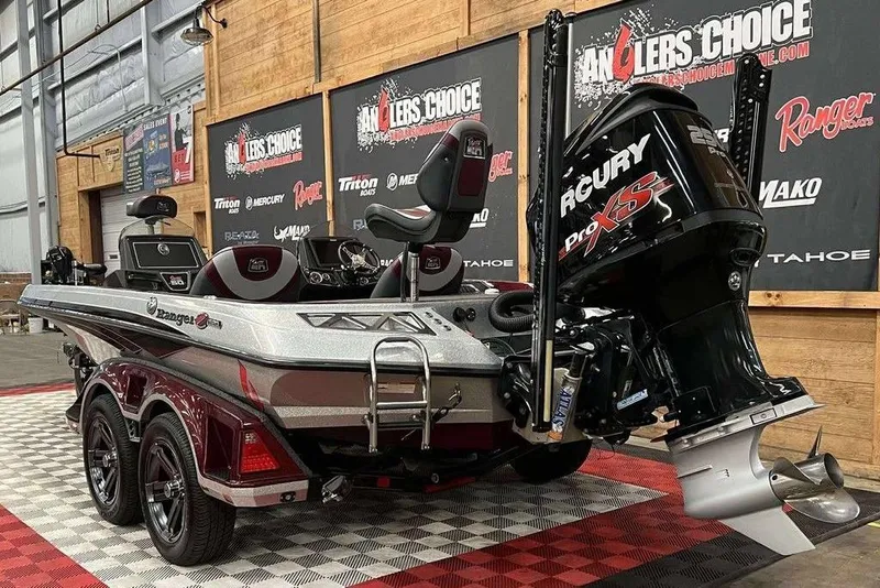 Slide: The Image of 2018 Ranger Z520L boat with Mercury Pro XS engine in showroom setting. - 3