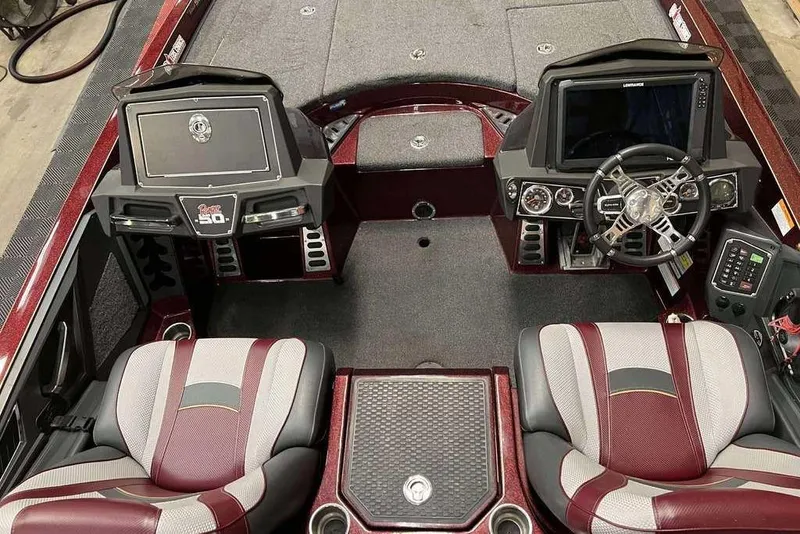 Slide: The Image of 2018 Ranger Z520L boat interior with dual seats, steering wheel, and control panel. - 4