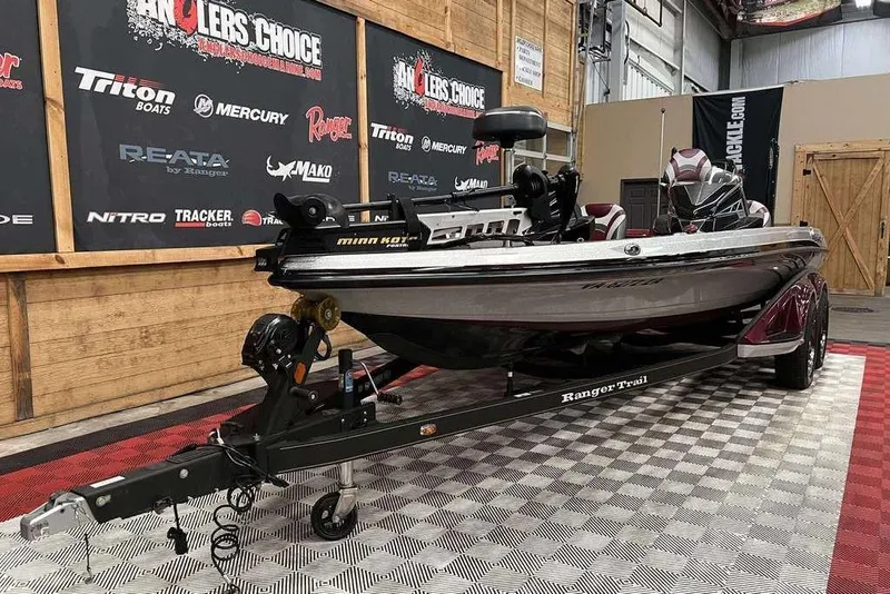 Slide: The Image of 2018 Ranger Z520L boat on display with trailer in showroom setting. - 6