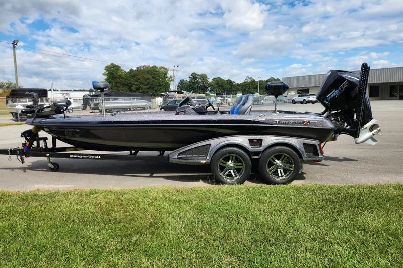 Slide: The Image of 2022 Ranger Z520R Ranger Cup Equipped boat on trailer, parked outdoors under a cloudy sky. - 5