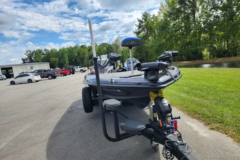 Slide: The Image of 2022 Ranger Z520R Ranger Cup Equipped boat on trailer, parked outdoors near trees. - 7