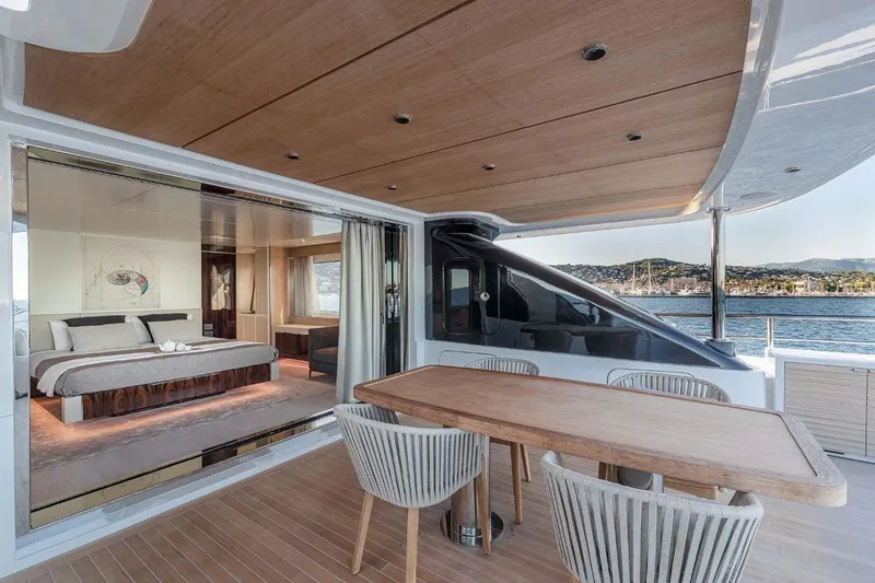 Slide: The Image of Luxurious 2023 Canados Expedition Yacht with elegant outdoor dining and spacious bedroom view. - 10